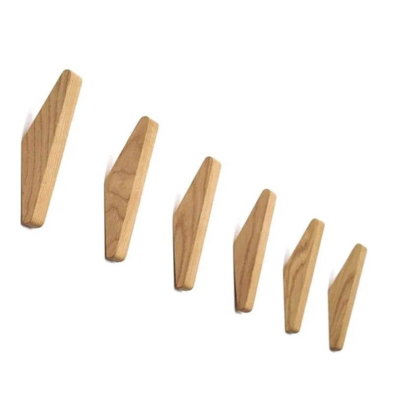 Triangle rubber wood wall hook with modern minimalist design for hanging coats and bags