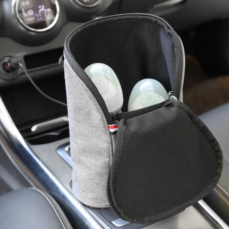 Grey portable baby bottle warmer with digital display for car travel use
