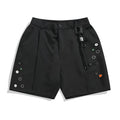 Black loose-fit semi-elastic shorts with button and zipper closure on a mid-rise waist
