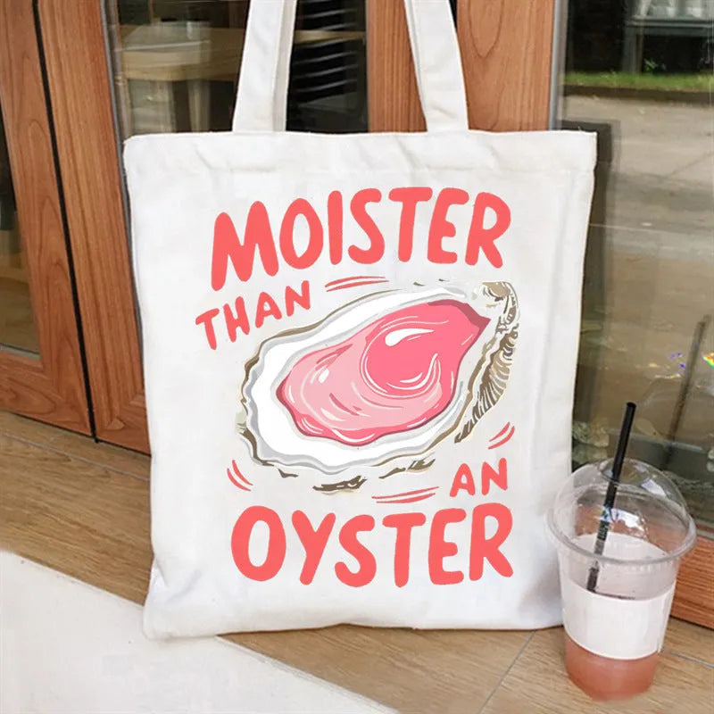 Women's canvas tote bag with printed letter pattern and chain detail in urban simplicity style