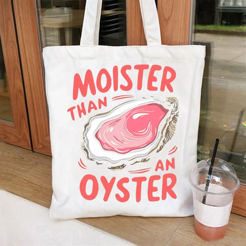 Women's canvas tote bag with printed letter pattern and chain detail in urban simplicity style