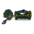 Green cloth pet collar and leash set with bowknot print on a white background showing collar and leash together