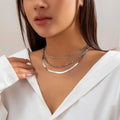 Multi-layer snake bone chain contrast colour necklace with U-shaped alloy pendant and pearl element on adjustable chain