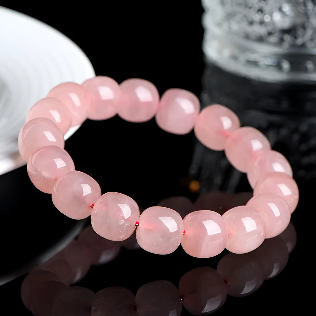 Natural pink crystal barrel-bead bracelet with 8x10mm polished geometry beads