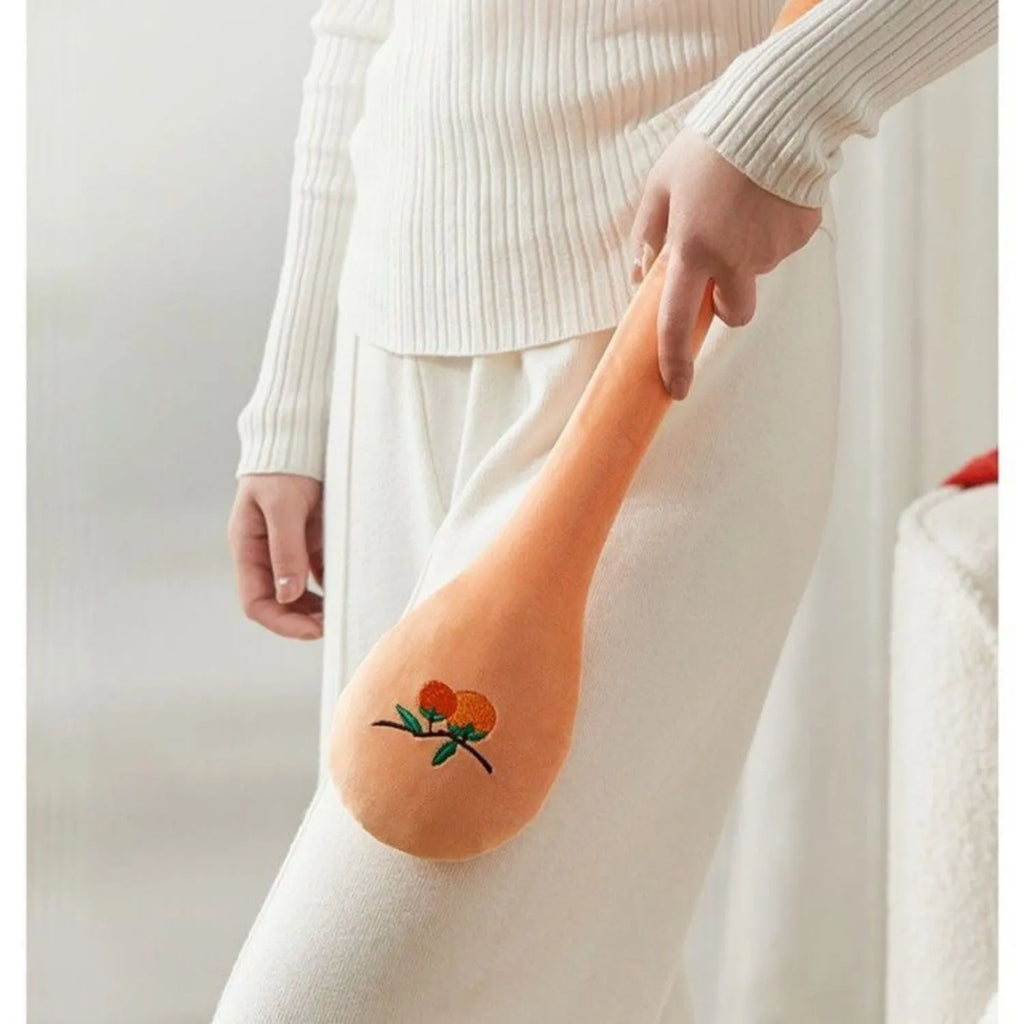 48 cm persimmon coloured back-pounding massage stick with meridian flap design and zipper style construction