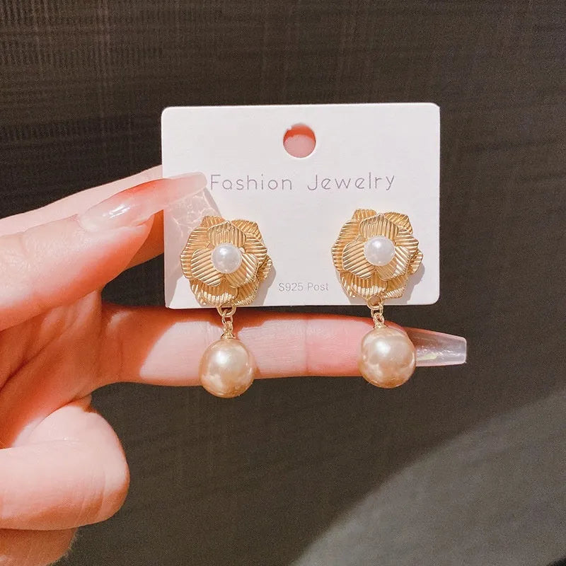 Gold electroplated sterling silver stud earrings with needle rose pearl design and opal stone accents