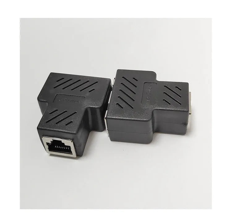 White RJ45 network cable tee splitter adapter on a dark background