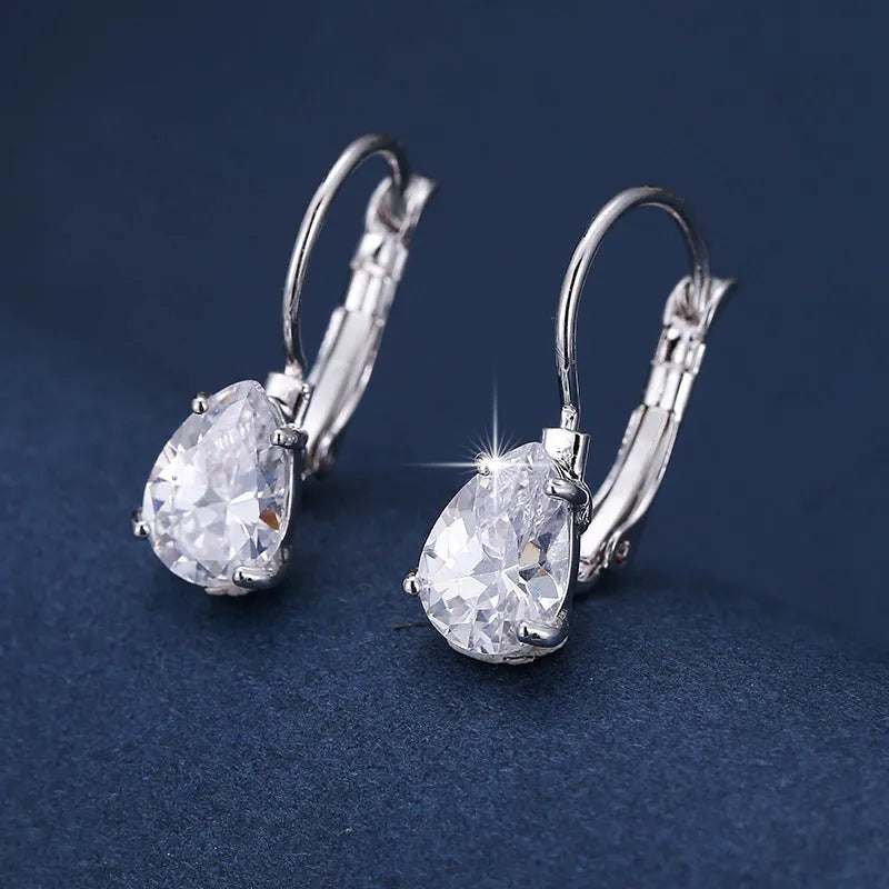 Drop-shaped women's metal earrings with gem inlay in gold or platinum colour