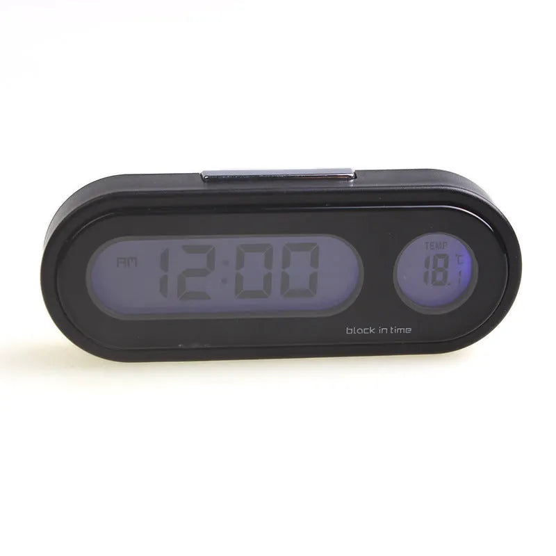 Black electronic car dashboard clock with LED display showing time and temperature