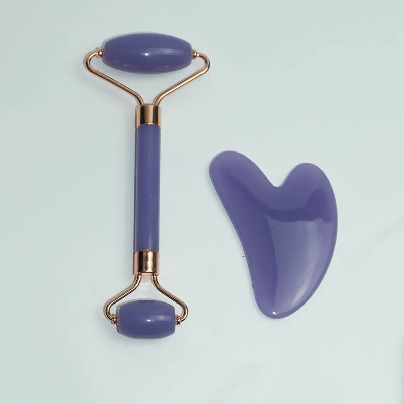 Stainless steel facial massage board with double head roller and heart-shaped eye poking stick for acupressure therapy