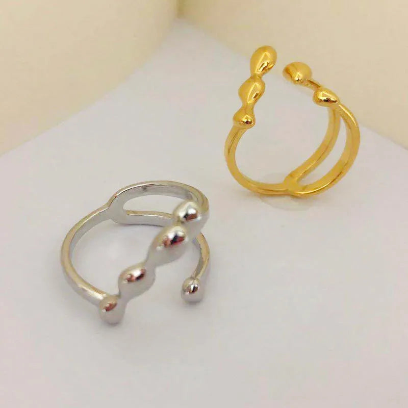 Adjustable brass opening ring with sphere design in gold colour for women