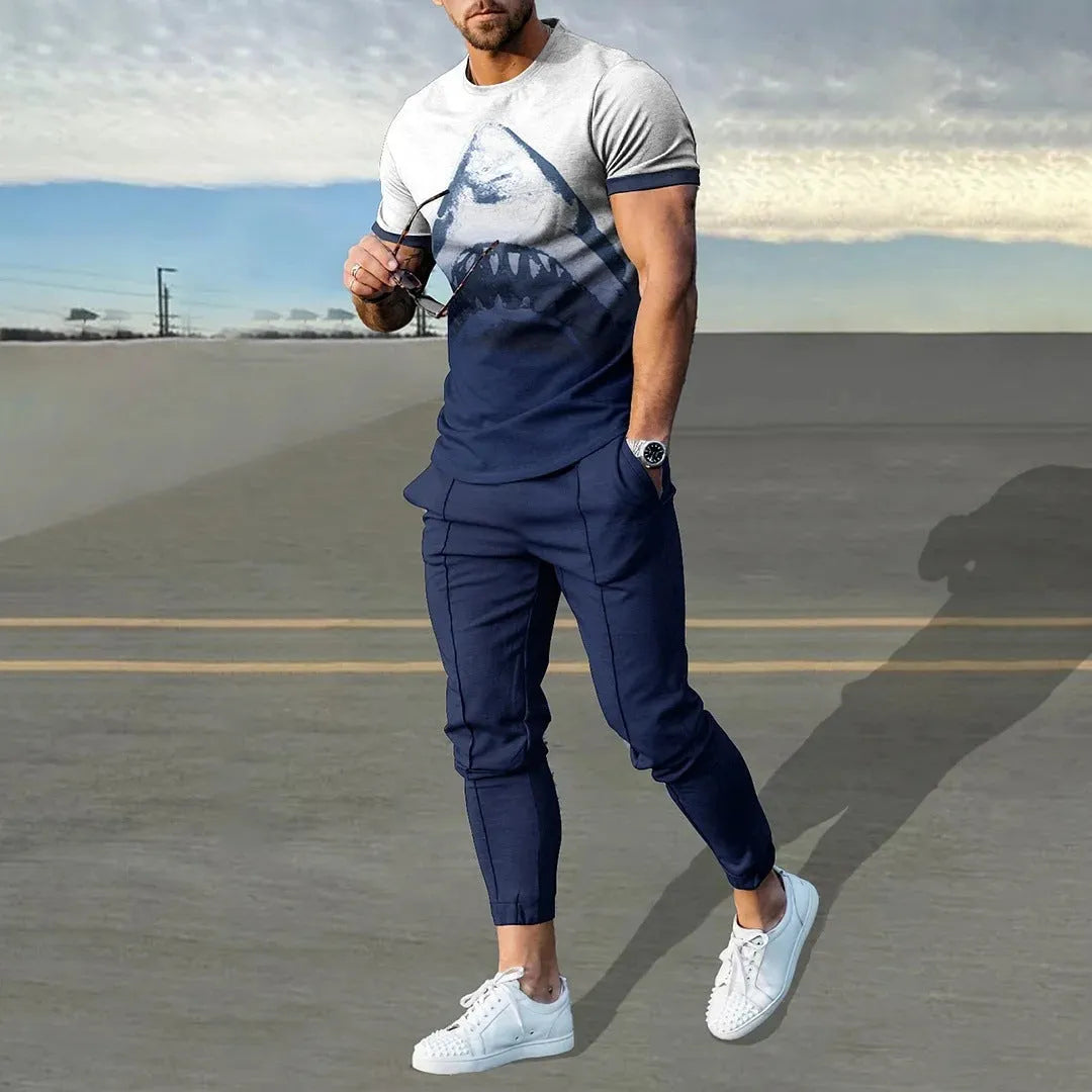 Man wearing a short-sleeved printed round neck pullover and matching trousers from a lightweight athletic suit set.