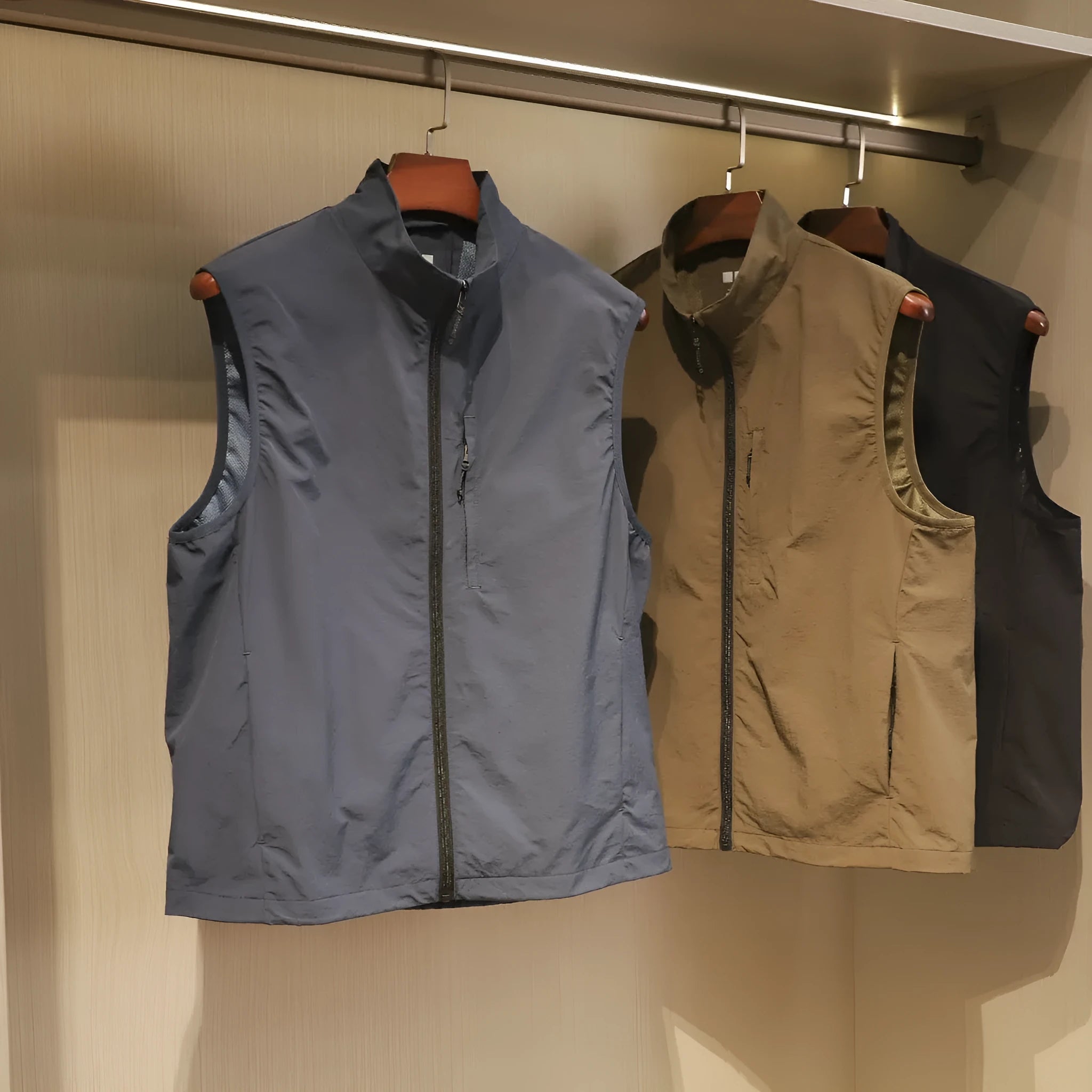 Men's straight-cut nylon cardigan vest in Army Green with side seam pockets.
