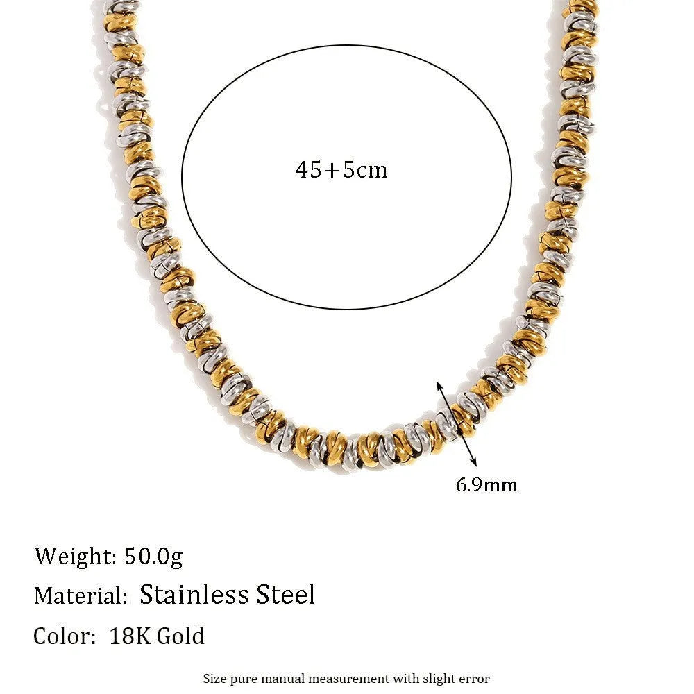 Women's geometric gold stainless steel jewellery set showing earrings, bracelet and necklace