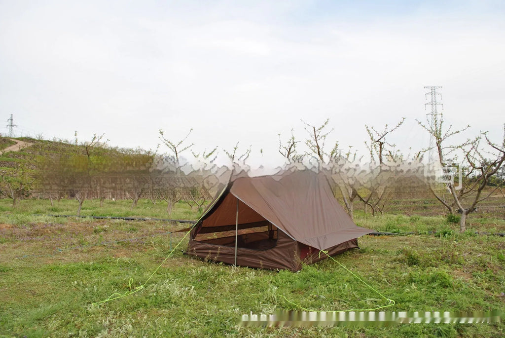 Brown or white A-line hiking tent without poles, supported by hiking canes