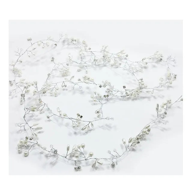 Bride's long hair band with pearls and crystals on a gold-coloured wire, shown coiled.