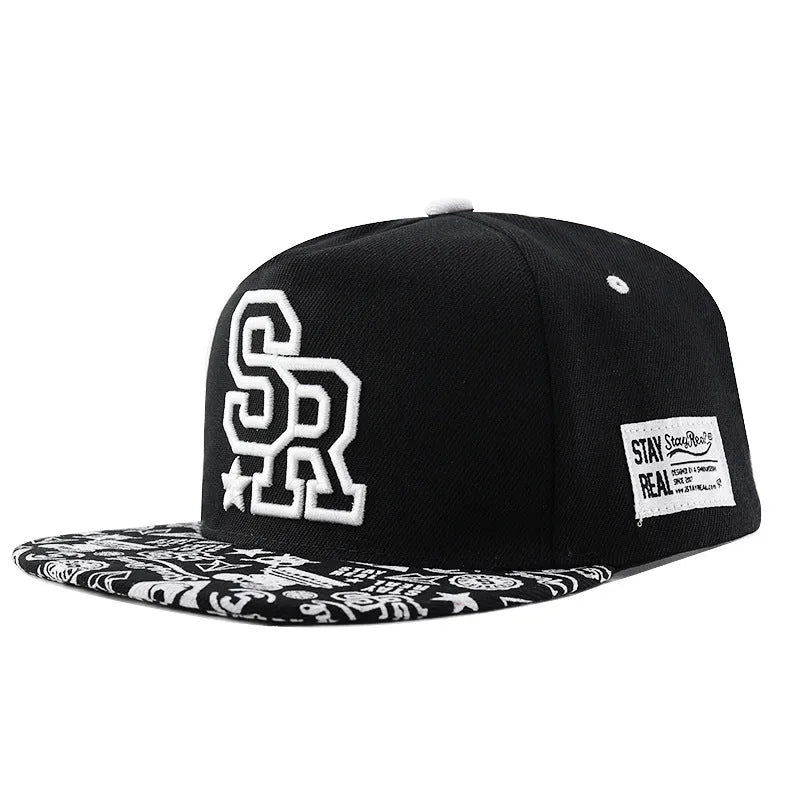 Cotton baseball cap with letter embroidery in black or white colours, showing adjustable strap and dome crown
