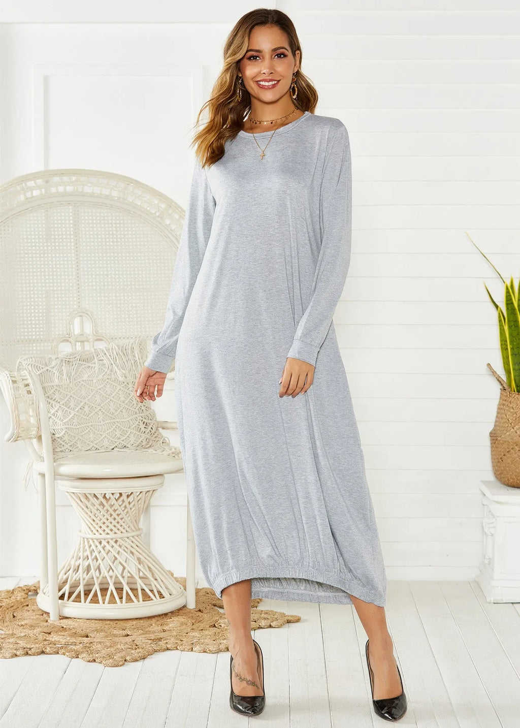 Black lantern dress with lace-up crew neck and loose silhouette casual knit fabric