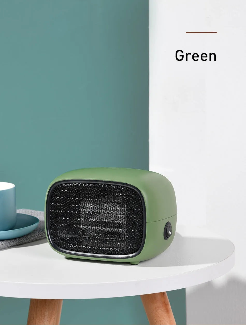 Green mini ceramic heater with compact design showing dimensions and ventilation grille