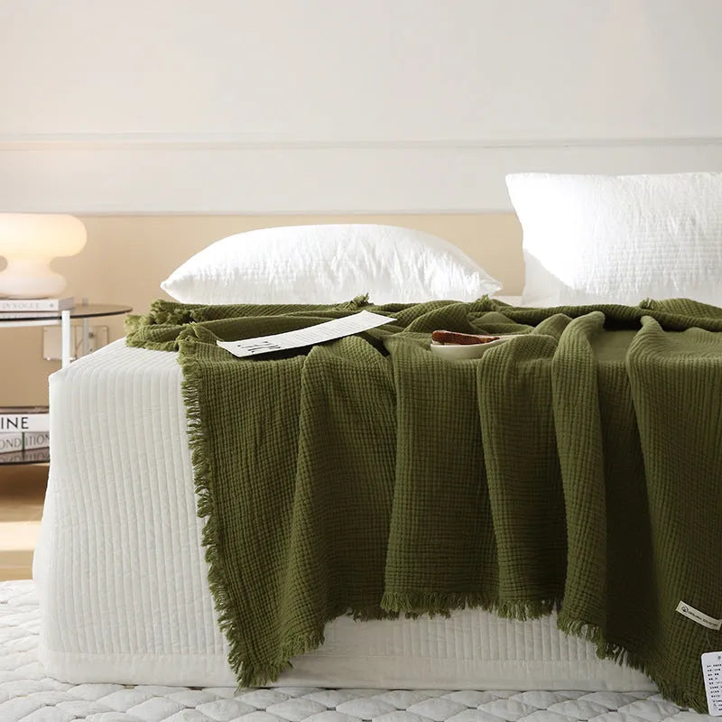 Four-layer gauze cotton blanket with tassel detailing in navy blue colour option