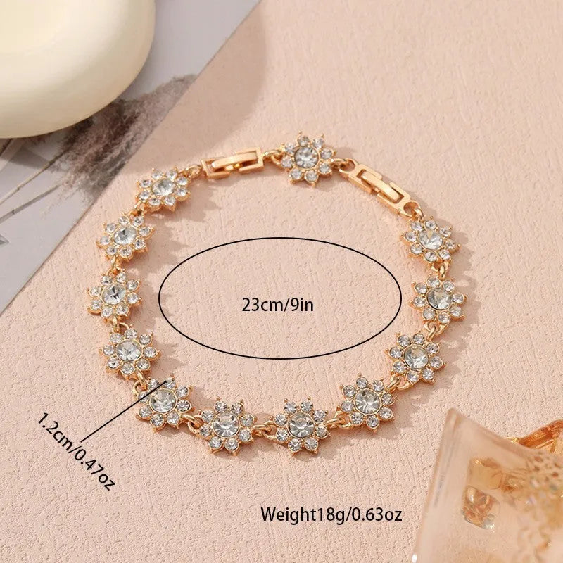 Floral-shaped zinc alloy bracelet with electroplated finish in gold and silver colour options.