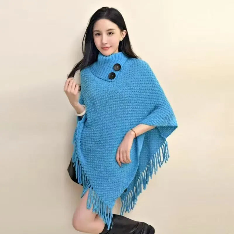 Women's casual plush triangle shawl cape with tassel details in a cashmere and acrylic fabric blend.