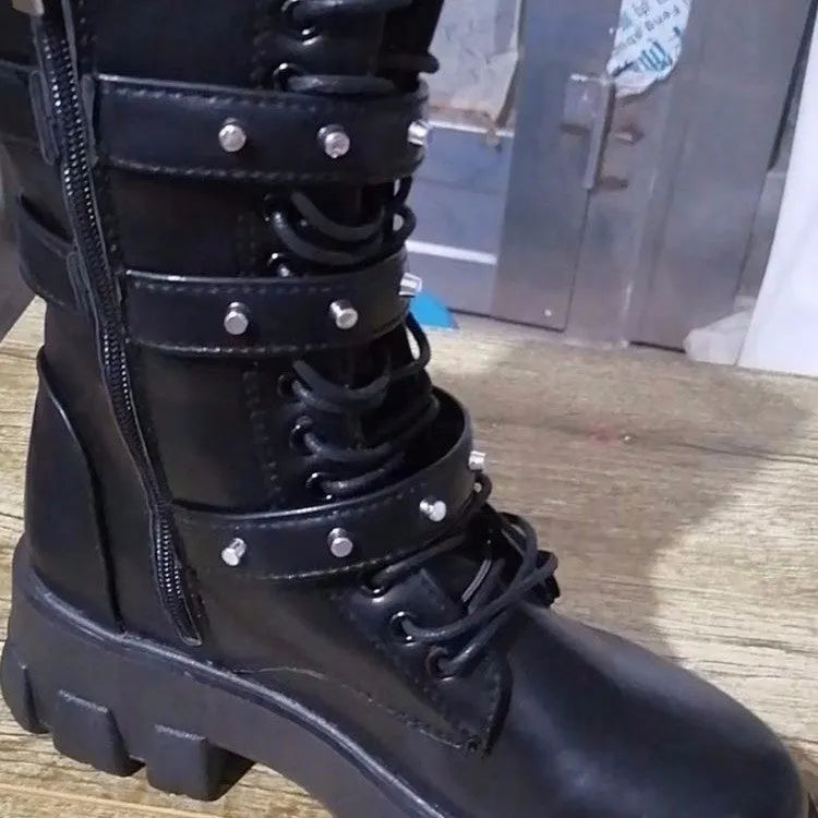 Women's black mid-calf knight boots with a side zip and metal buckle detail on the shaft.