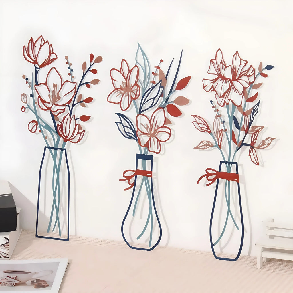 Set of three metal wall art decorations with flowers and coloured vases in modern farmhouse style.