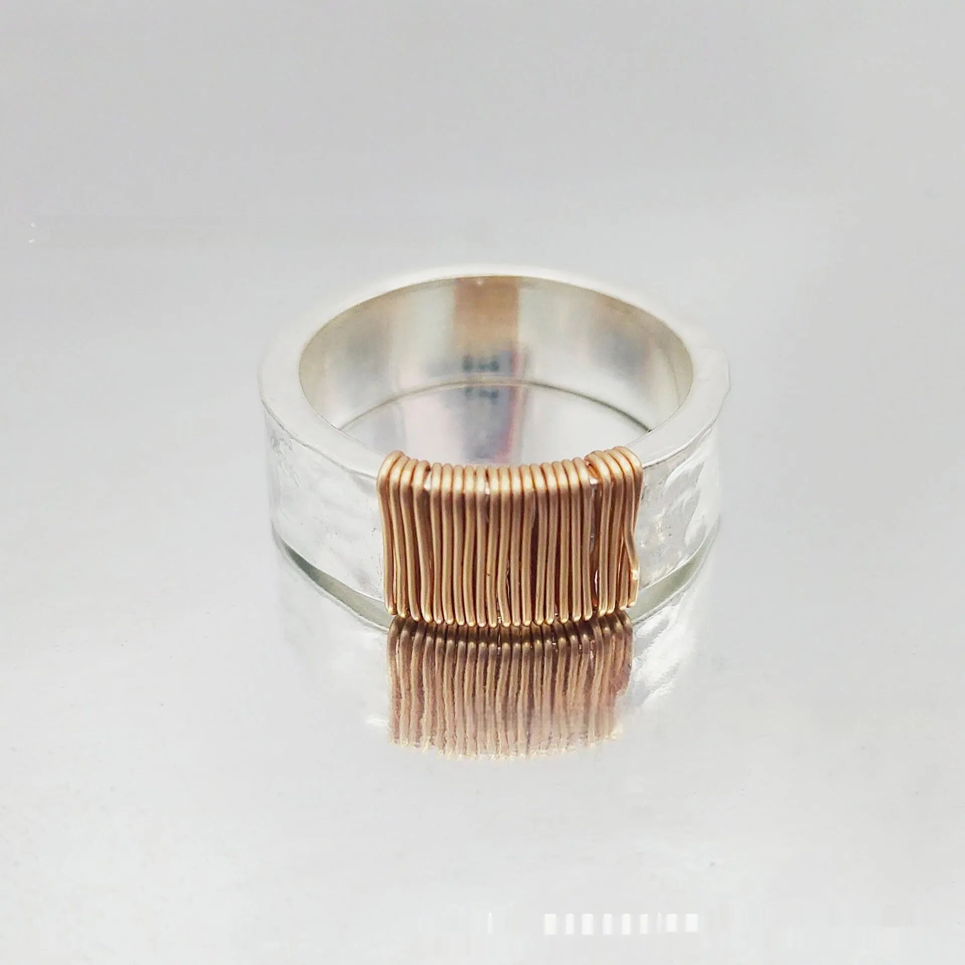 Copper bracelet with vintage ring design featuring irregular coil pattern in silver golden colour