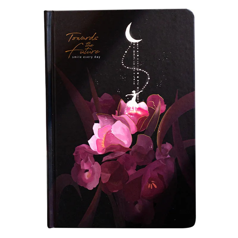 A5 size diary book with a luminous purple cover, open to show pages with colour illustrations.