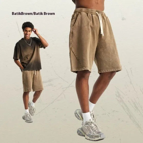 Men's batik washed cotton terry shorts in loose retro style with patchcraft colour effects