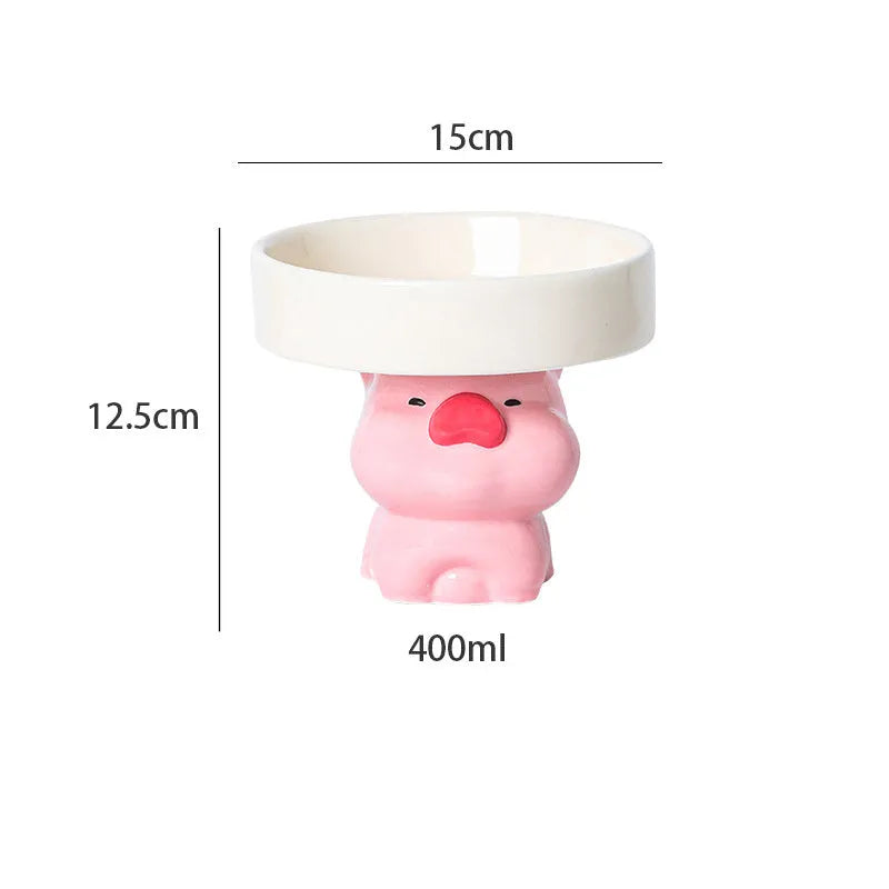 White ceramic raised cat bowl with bear design, showing wide opening and elevated base.