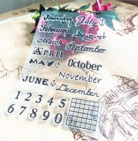 Vintage icon seal calendar stamp in transparent silicone on a crafting surface.