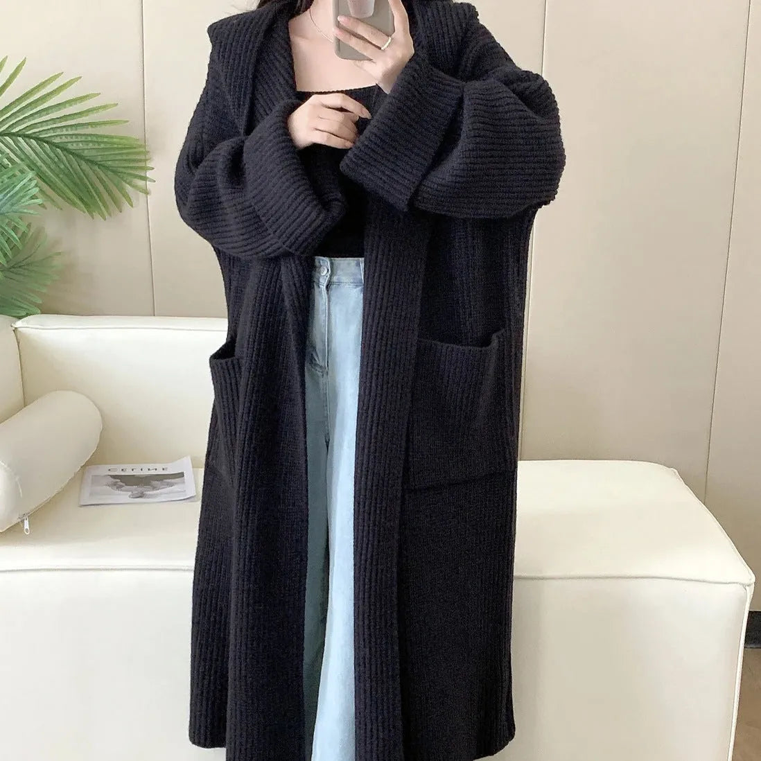 Loose fit women's hooded cardigan coat in soft acrylic fabric, shown in milky white.