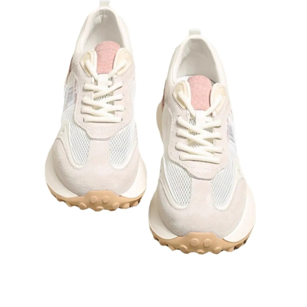 Grey and pink women's low-top retro sneakers with round toe and shallow mouth on a rubber sole.