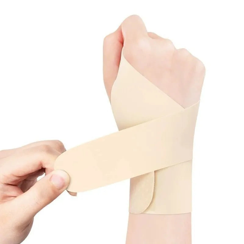 Black adjustable athletic wristguard for wrist support during sports like badminton and tennis.