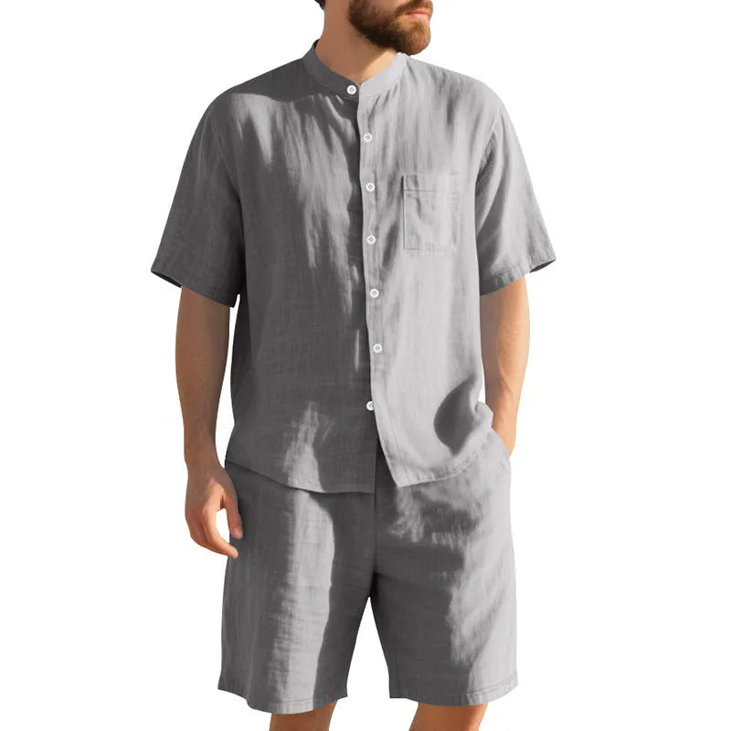 Men's light blue linen blend summer suit with henry collar, short sleeves, and matching shorts