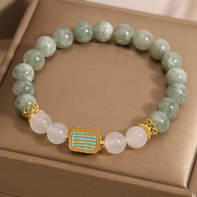 Women's oil green emerald crystal bracelet with five-strand design on female wrist