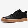 Men's black leather casual shoes with round toe, flat heel, and white lace-up closure.