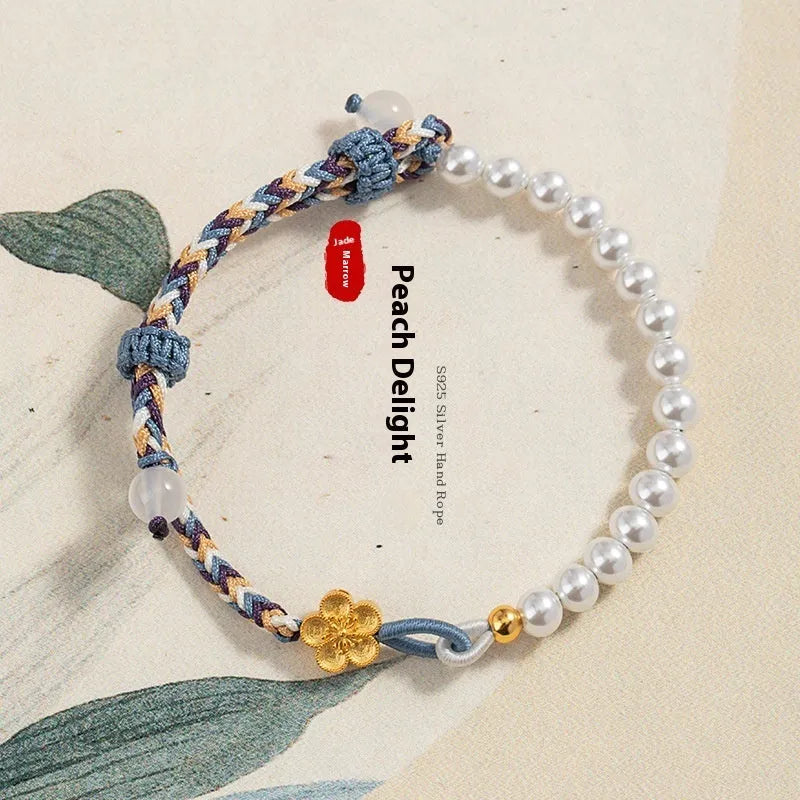 Colourful carrying strap bracelet with Chinese flower weaving and pearls in peach colour