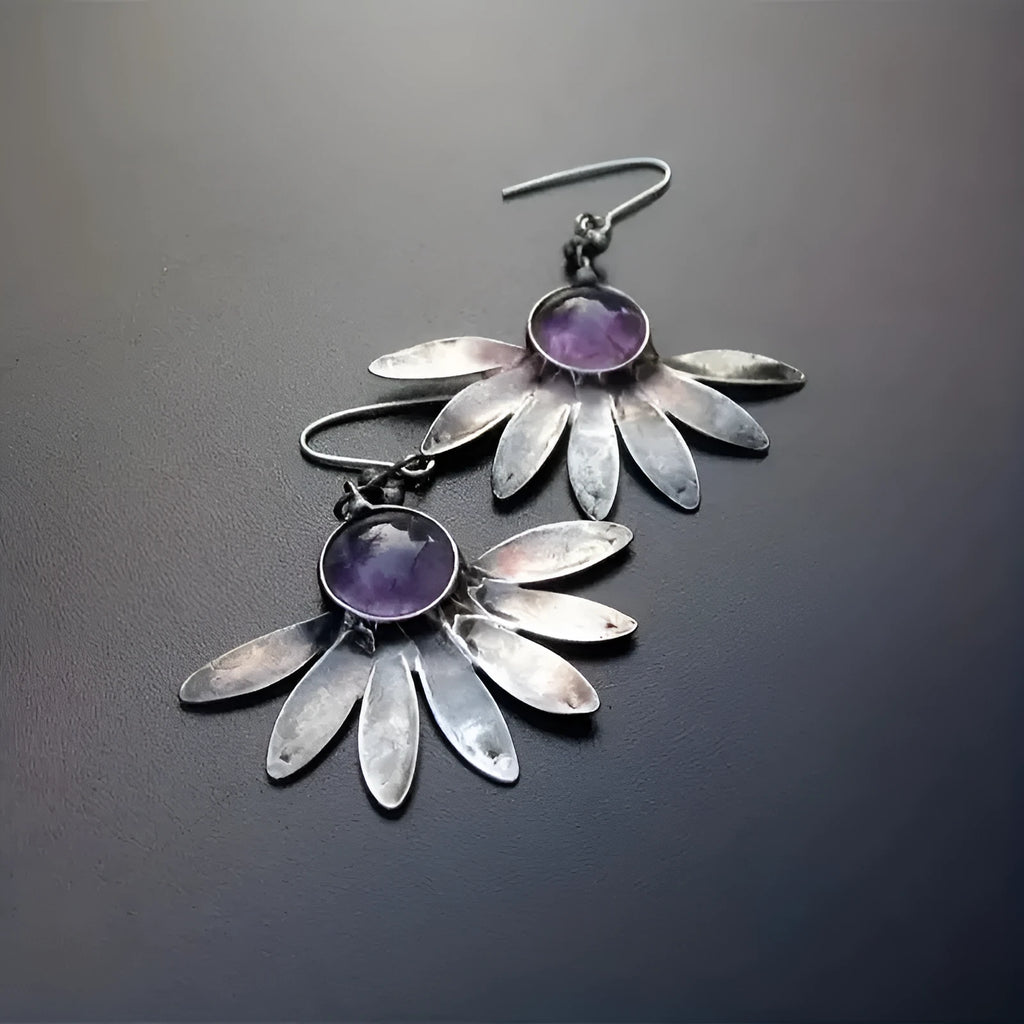 Purple bohemian style earrings with resin gemstone accents and animal zodiac modelling