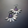 Purple bohemian style earrings with resin gemstone accents and animal zodiac modelling