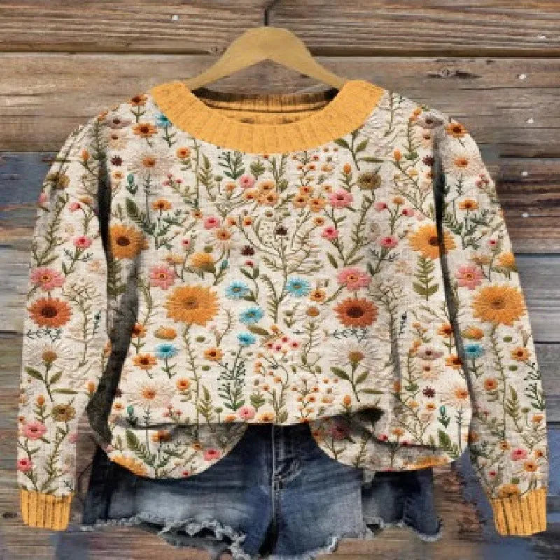 Women's round neck sweater with a small digital floral print in a solid colour.