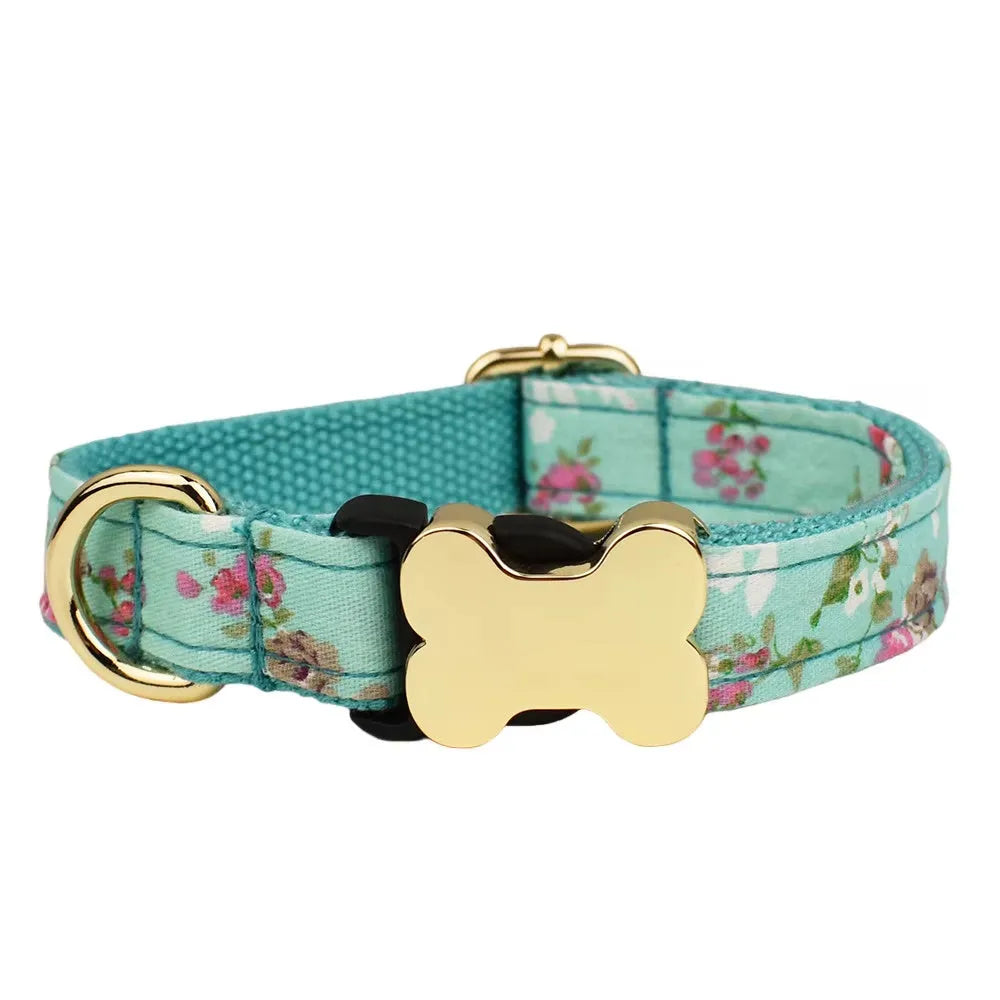 Flat nylon dog collar with a printed grid pattern and a central bone-shaped metal buckle.