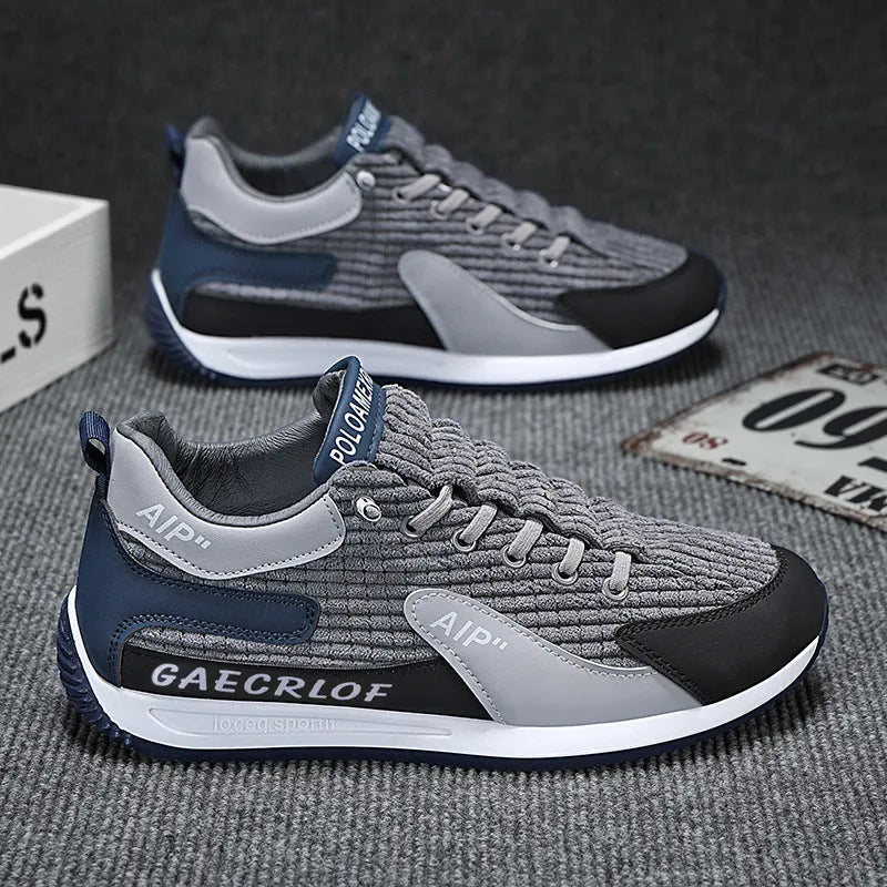 Men's grey and green mesh running shoes with round toe and lace-up front