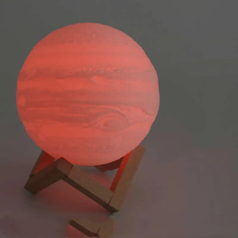 3D printed white moon lamp on wooden stand with colour-changing LED light