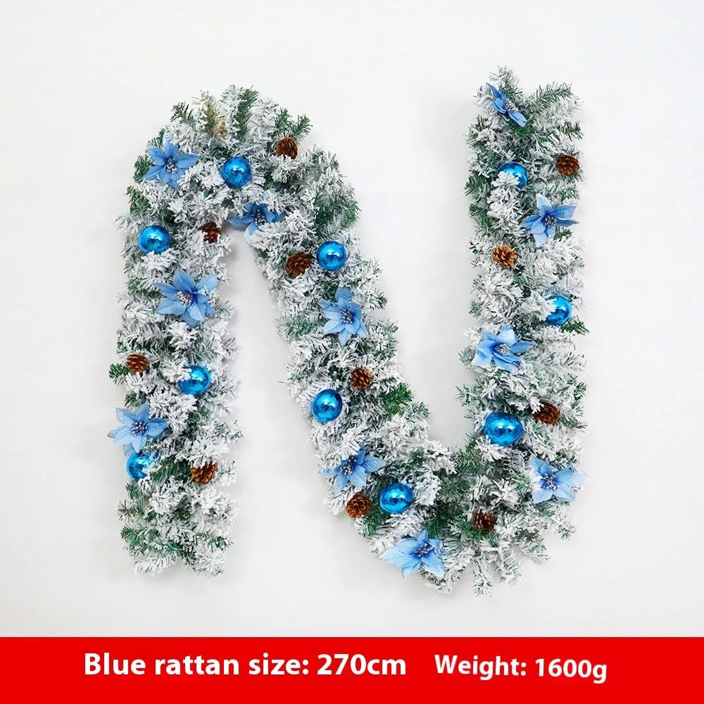 Christmas rattan garland decoration with flocked texture in five colour options displayed draped