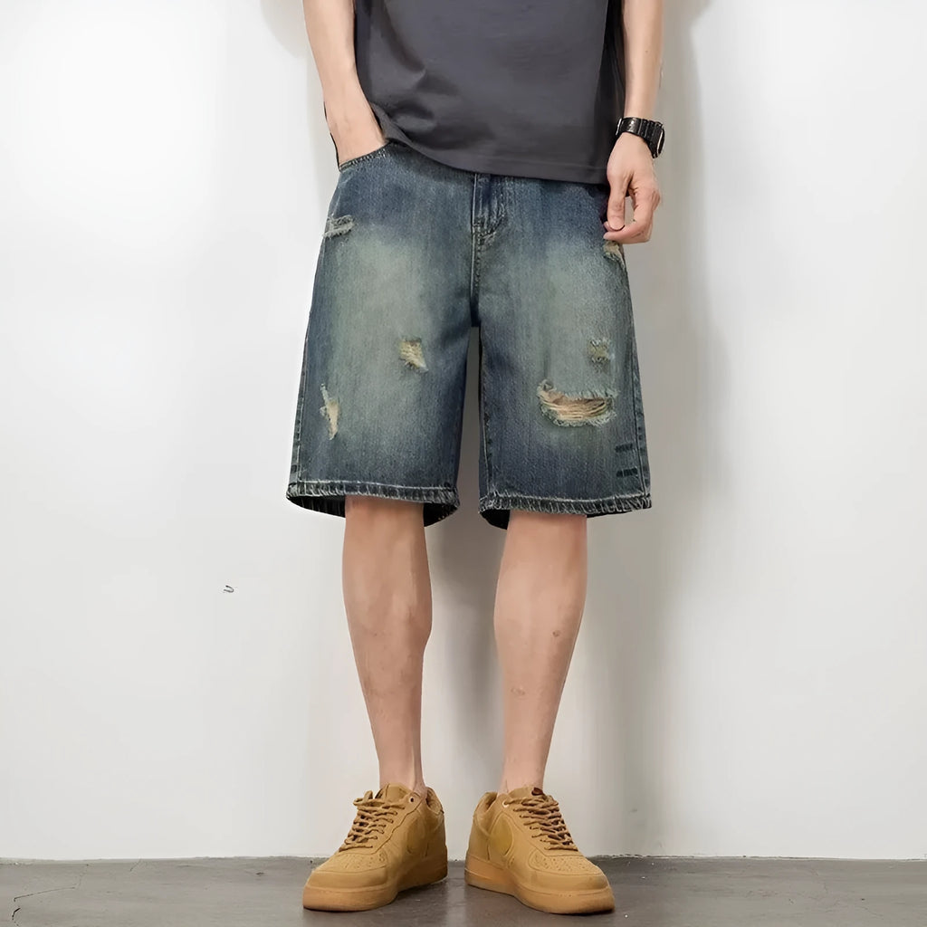 Blue men's denim shorts with a retro loose hole design and straight-leg cut.