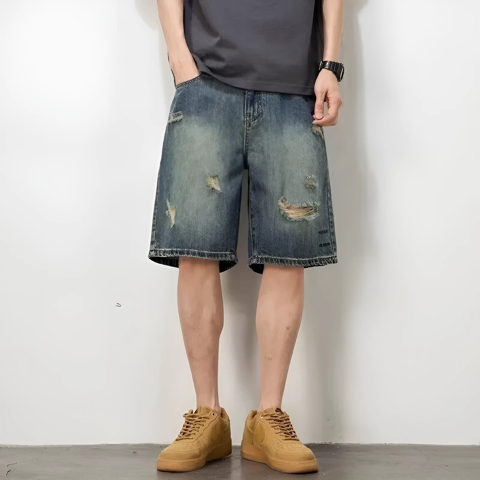 Blue men's denim shorts with a retro loose hole design and straight-leg cut.