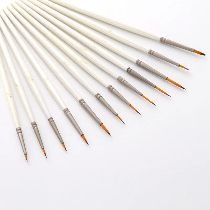 Set of twelve fluorescent marker artist brushes in assorted sizes, stored upright in a solid wood pen holder.